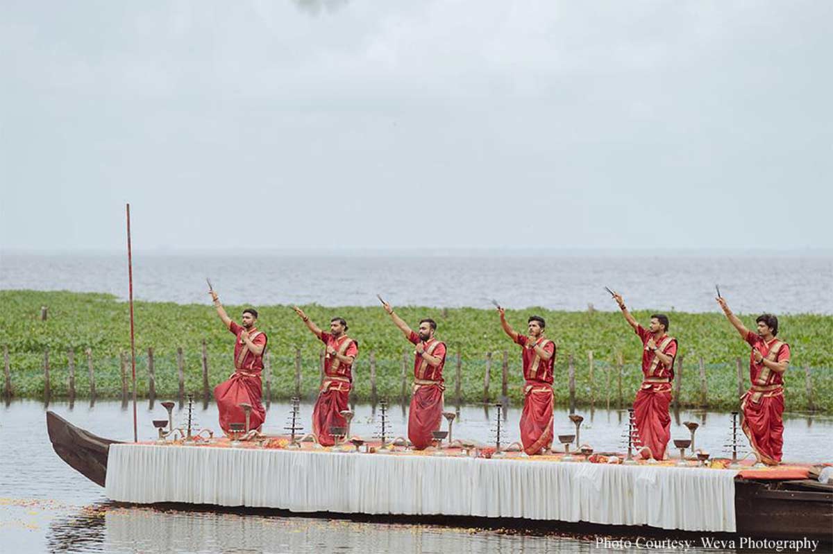 Framed by tranquil backwaters, this cross-cultural wedding came alive with the culture and verdant beauty of Kerala!