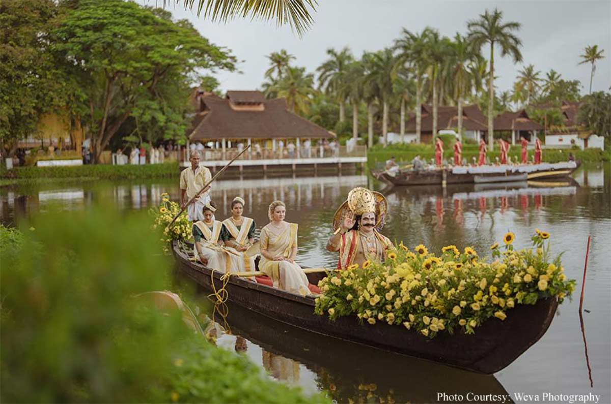 Framed by tranquil backwaters, this cross-cultural wedding came alive with the culture and verdant beauty of Kerala!