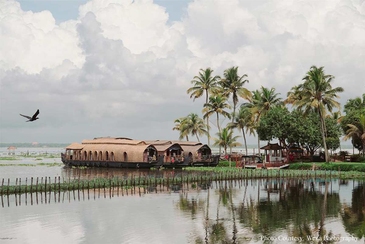 Framed by tranquil backwaters, this cross-cultural wedding came alive with the culture and verdant beauty of Kerala!