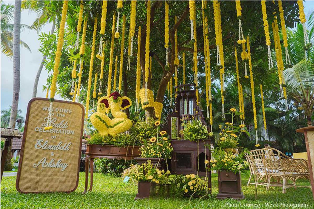 Framed by tranquil backwaters, this cross-cultural wedding came alive with the culture and verdant beauty of Kerala!