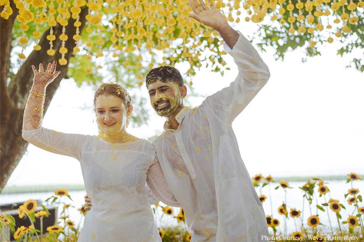 Framed by tranquil backwaters, this cross-cultural wedding came alive with the culture and verdant beauty of Kerala!