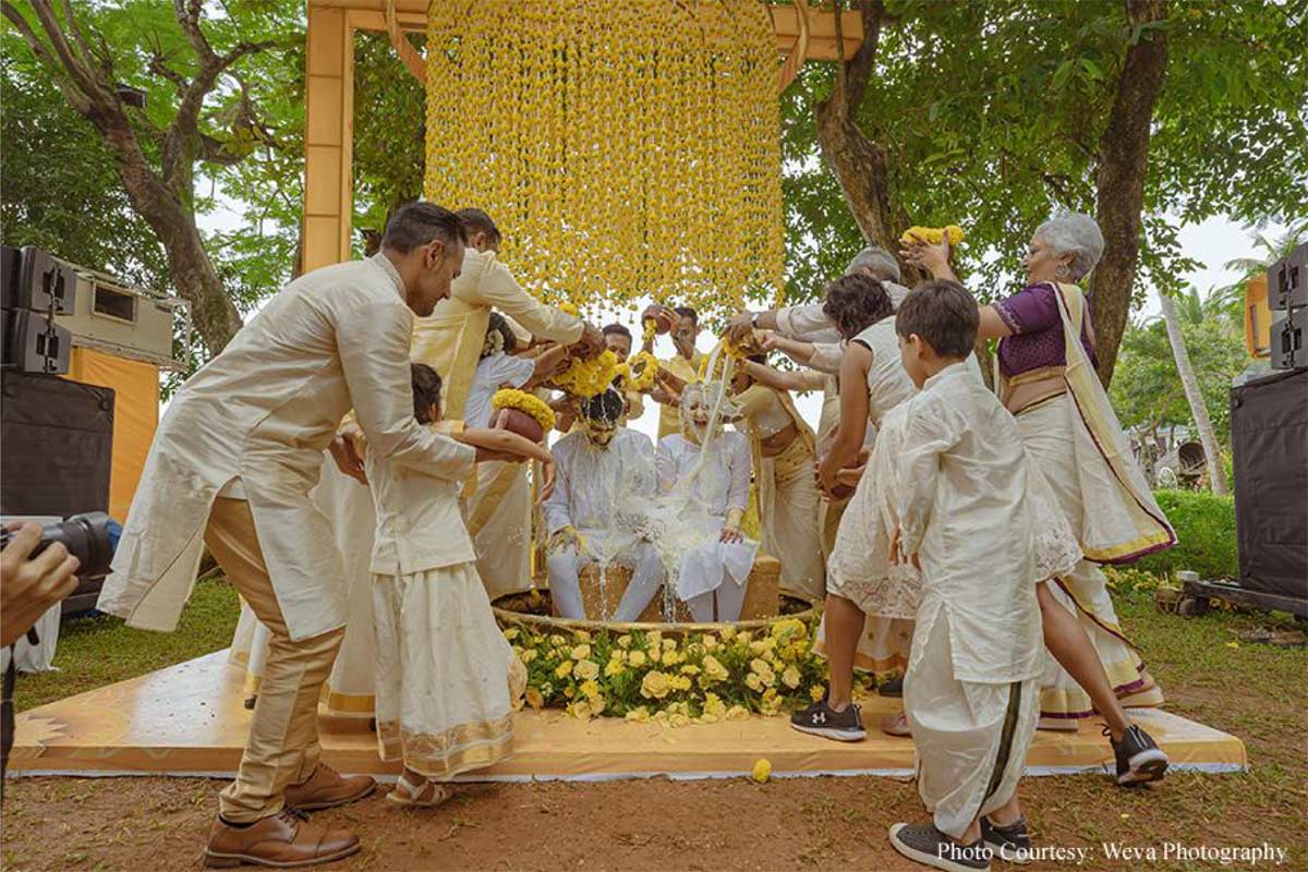 Framed by tranquil backwaters, this cross-cultural wedding came alive with the culture and verdant beauty of Kerala!